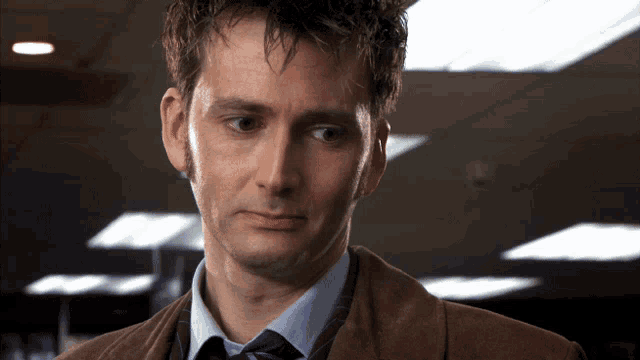 a close up of a man 's face with a serious look on his face