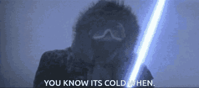 a person holding a light saber with the words " you know its cold when "