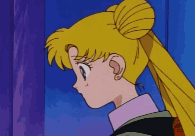 a close up of a girl with a bun on her head