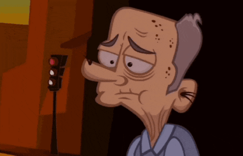 a cartoon character with a sad look on his face stands in front of a traffic light