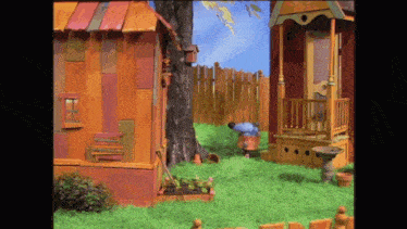 a cartoon scene with a house that has the word life on the front of it