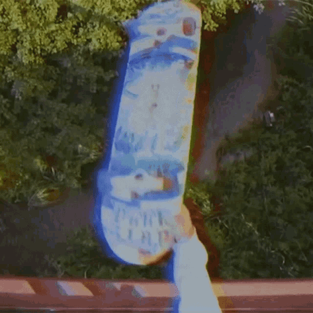 a person holding a skateboard that says park lap on it