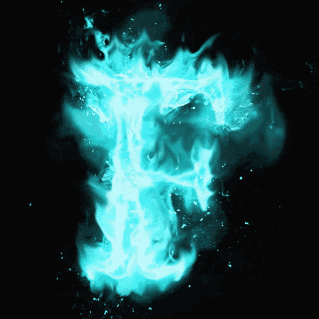 the letter t is lit up with blue flames