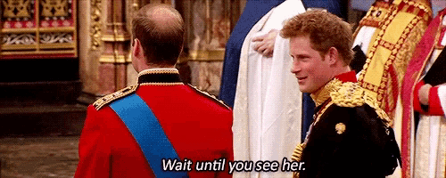 two men in military uniforms are standing next to each other and one of them is saying wait until you see her .