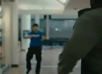a blurry photo of a man in a blue shirt