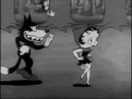 a black and white cartoon of a wolf and a little red riding hood dancing .