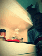 a blurry picture of a person taking a picture in a refrigerator