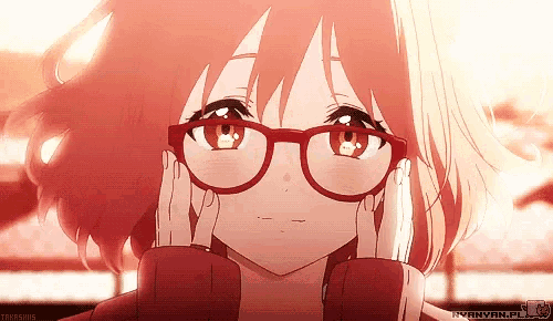 a girl wearing red glasses and a red sweater is looking at the camera
