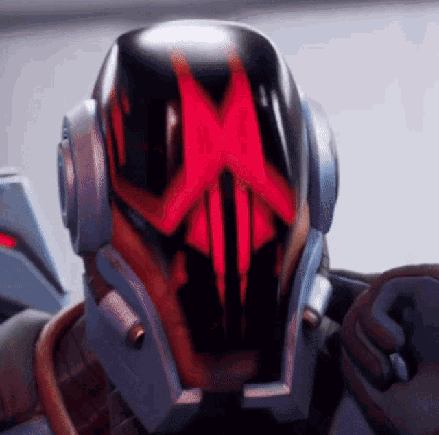 a close up of a robot 's helmet with a red x on it