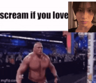 a man without a shirt is screaming in front of a woman .