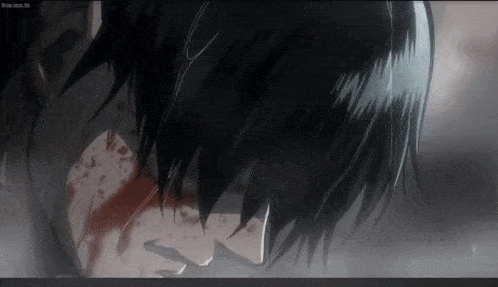 a close up of a man 's face with blood on it .