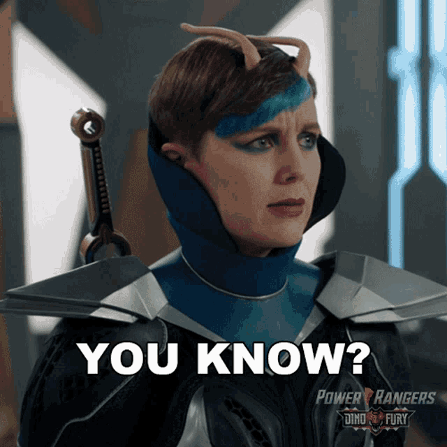 a woman in a power rangers costume is asking if she knows