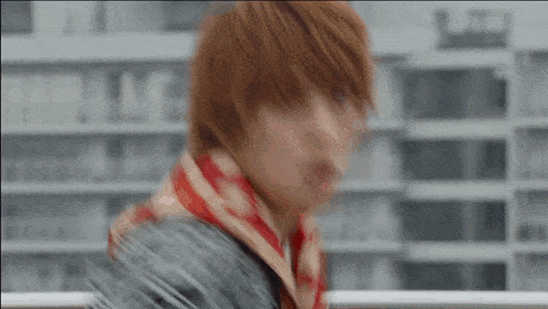 a blurry picture of a man with red hair