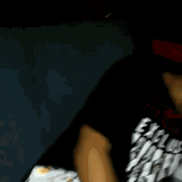 a close up of a person 's face with a hat on .