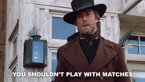 a man in a top hat stands in front of a building with the words " you should n't play with matches "