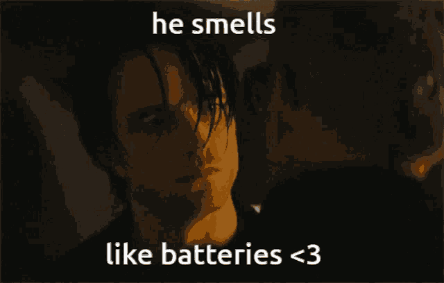a picture of a man with the words he smells like batteries < 3