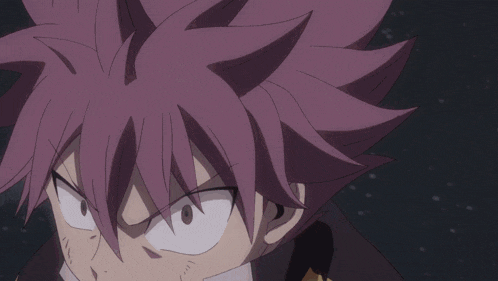 a fairy tail character is holding a fireball in his hand