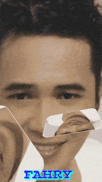 a close up of a man 's face with the name fahry above him