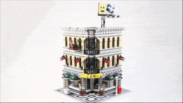a lego model of a building with a billboard on top that says ' bb ' on it