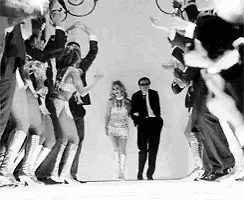 a man and a woman are dancing in a black and white photo .