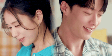 a man and a woman are sitting next to each other and smiling .