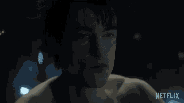 a close up of a man 's face with netflix written on the bottom right
