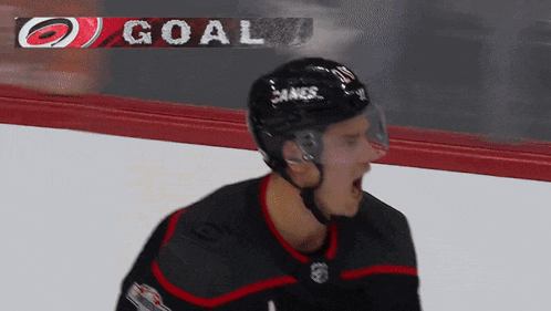 a hockey player wearing a helmet with the word kings on it