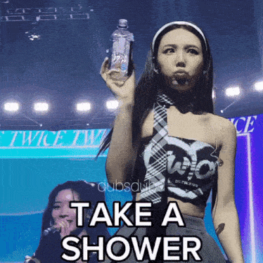 a woman holding a bottle with the words take a shower written on it