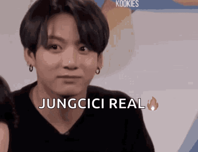 a young man is making a funny face and says jungcici real