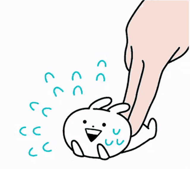 a hand is touching a cartoon rabbit with a smiley face .