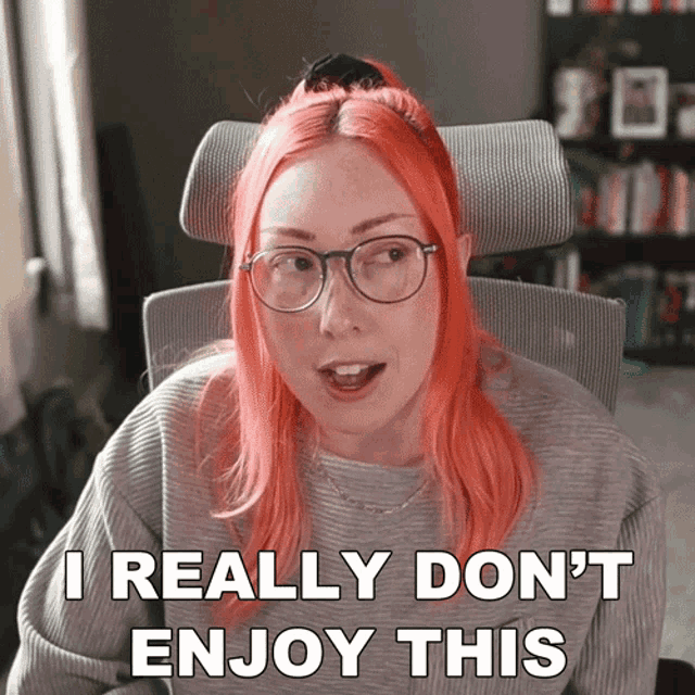a woman with red hair and glasses says i really don t enjoy this