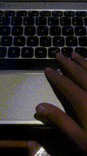 a close up of a person 's hand typing on a keyboard