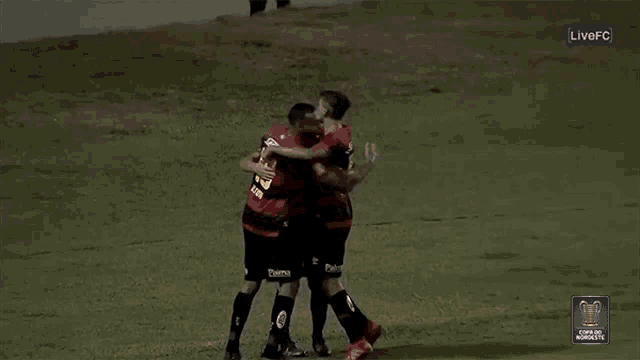 a soccer player with the number 10 on his jersey is hugging another player