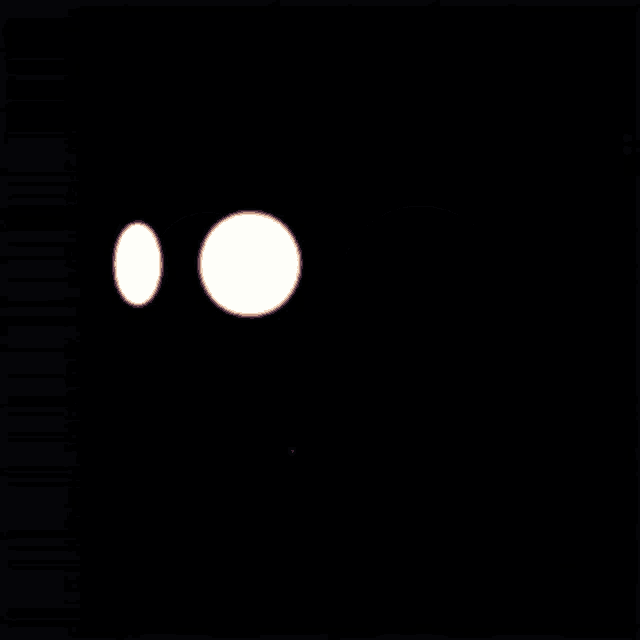 two white circles on a black background that look like a smiley face