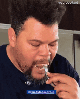 a man with a beard is eating something with a fork with the words " you cooked " written below him
