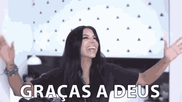 a woman with her arms outstretched and the words graças a deus written on the screen .