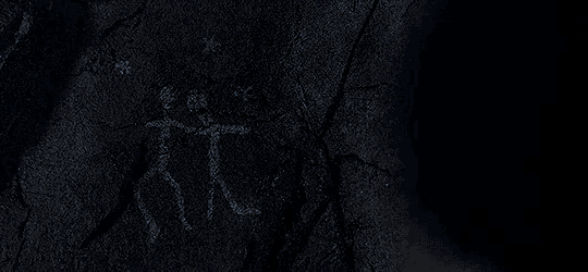 a drawing of a man and a woman is on a wall