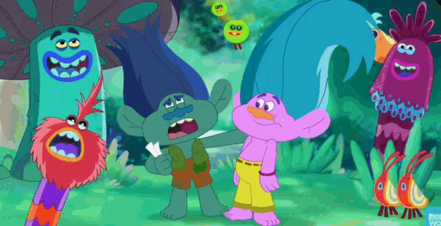 a group of trolls are standing next to each other in a forest