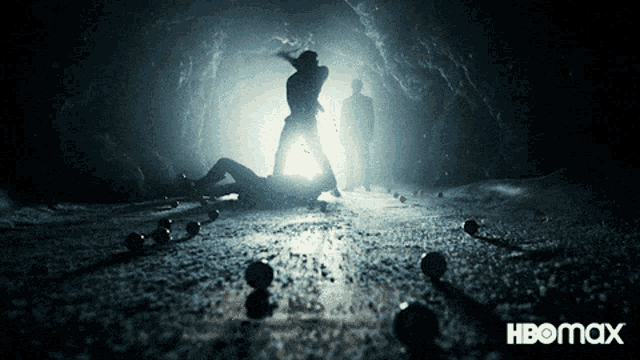 a poster for hbomax shows a group of people in a dark cave