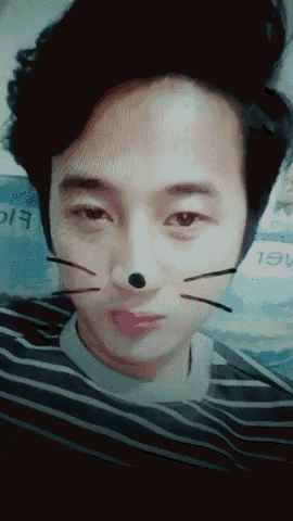 a close up of a man 's face with a cat 's nose