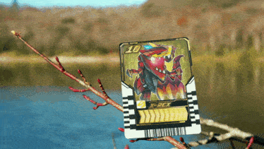 a card that says x-rex is sitting on a tree branch
