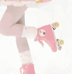 a doll is wearing a pink and yellow skirt