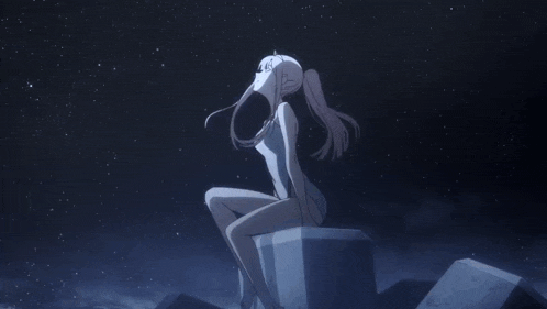 a statue of a woman sitting on a rock looking up at the stars