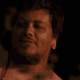 a close up of a man with his mouth wide open