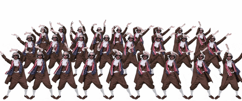 a bunch of people are standing in a line with their arms up