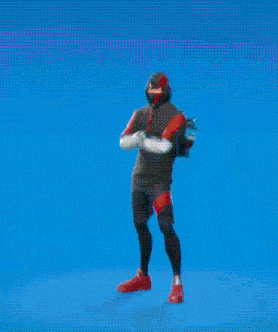 a man is standing in front of a blue background holding a punching bag in his hand .
