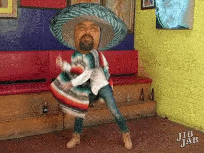 a man in a sombrero and poncho is dancing in a jib jab room