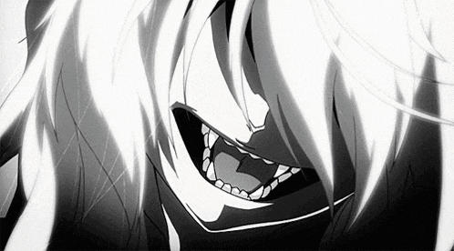 a close up of a person 's face with fangs coming out of their mouth .