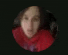 a blurry picture of a woman 's face in a red scarf in a circle .