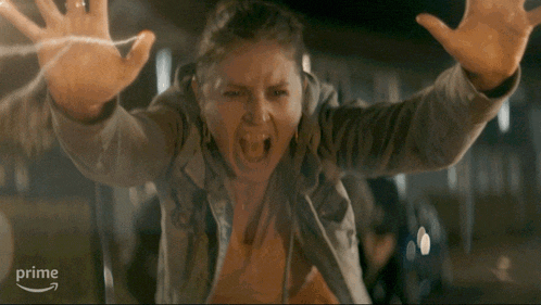 a woman is screaming in front of a sign that says " prime "